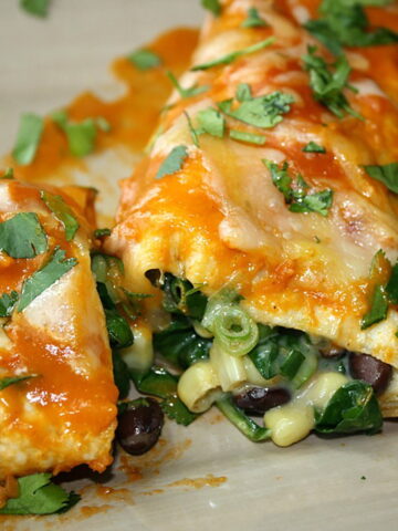 Black bean spinach enchiladas on a plate