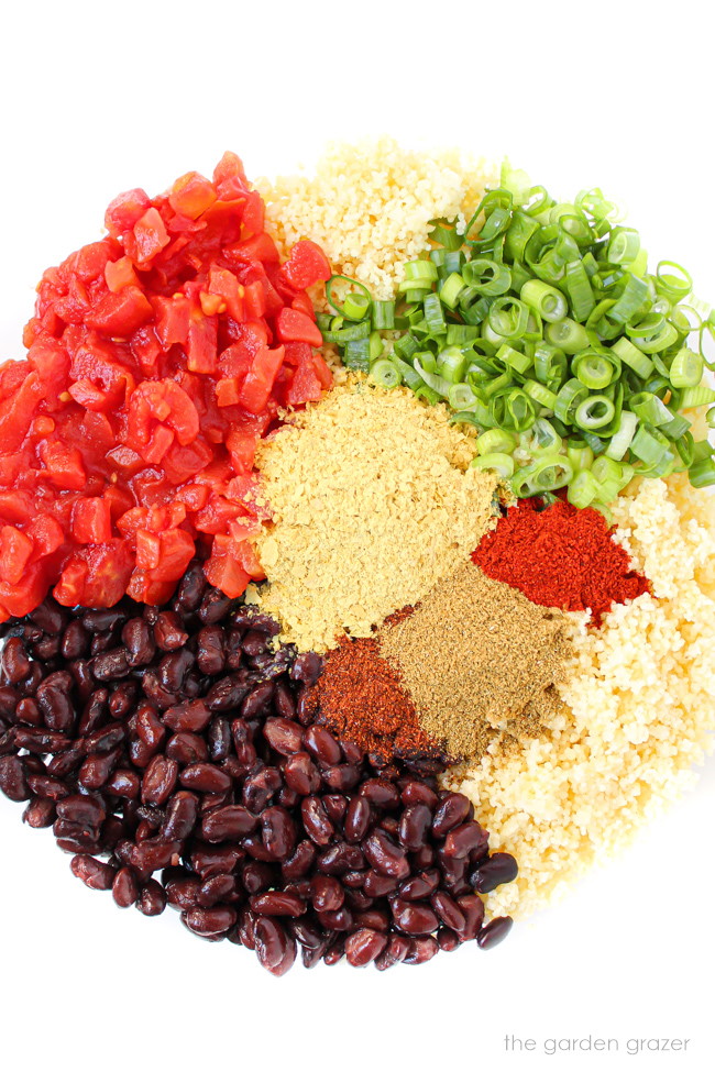 Ingredients for couscous stuffed peppers in a large glass bowl