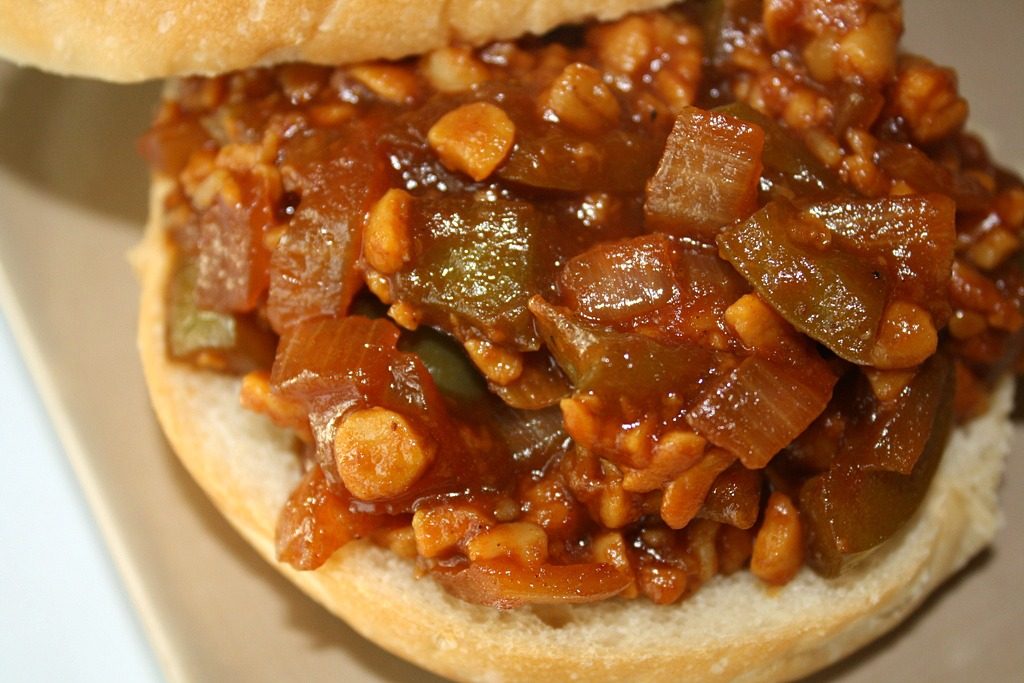Vegan tempeh sloppy joe on an open-faced bun