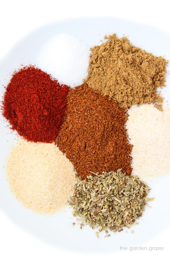 Spices on a plate for homemade taco seasoning ingredients