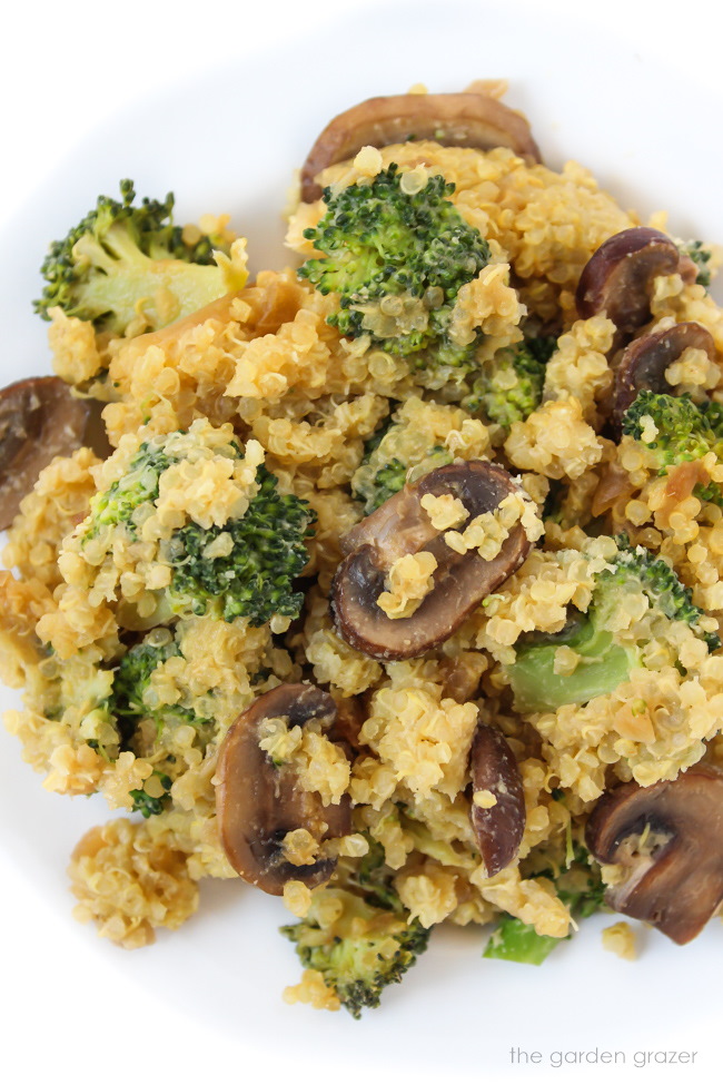 Vegan quinoa broccoli mushroom casserole on a white plate