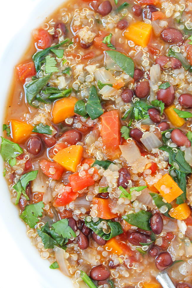 Vegan quinoa black bean soup in a white bowl