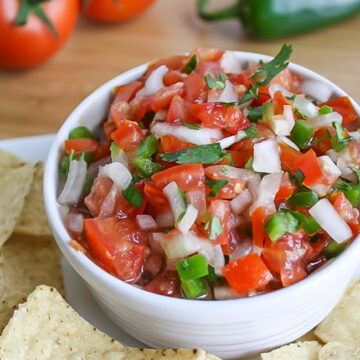 Bowl of fresh salsa fresca with chips on the side