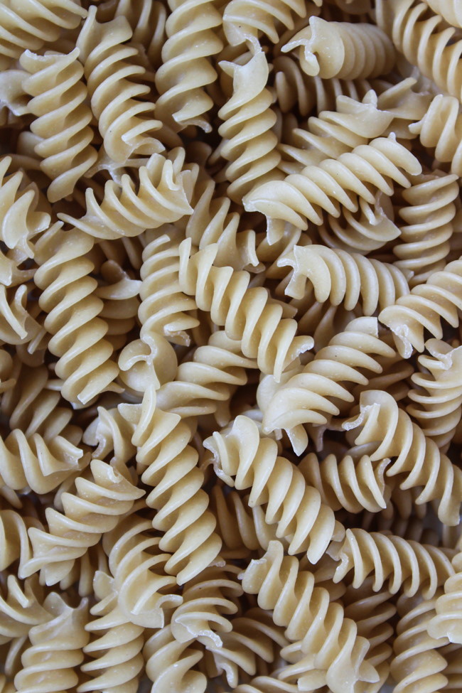 Close-up view of uncooked gluten-free fusilli pasta ingredient