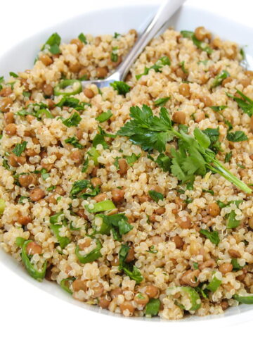 Lentil quinoa salad in a white bowl