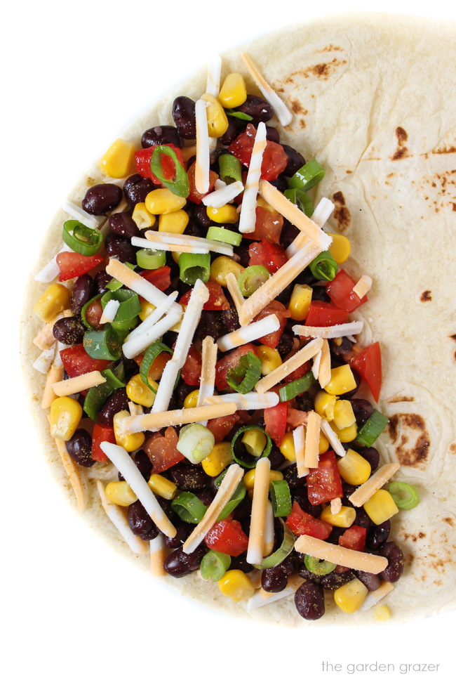 Ingredients on half of an open-faced tortilla