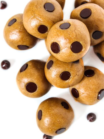 Healthy vegan cookie dough bites with chocolate chips on a white plate