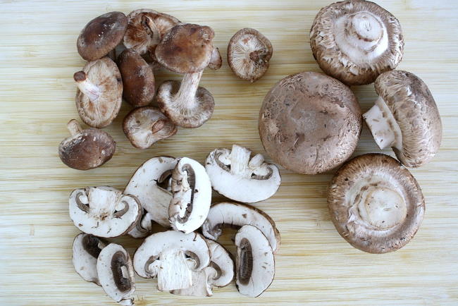 Fresh mushroom ingredients on a cutting board