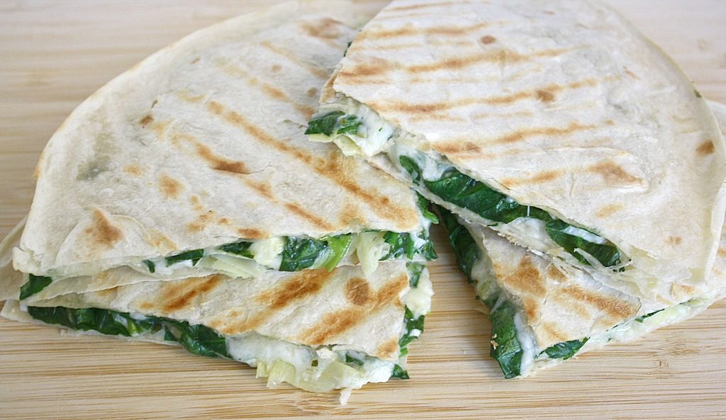 Vegan artichoke quesadillas cut in half