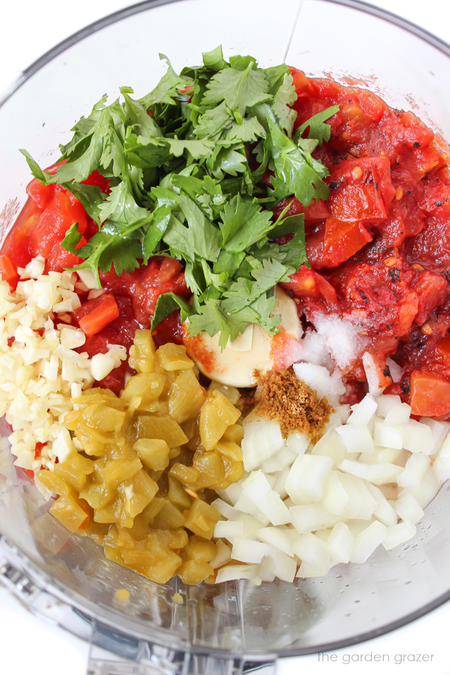 Ingredients for salsa in a food processor