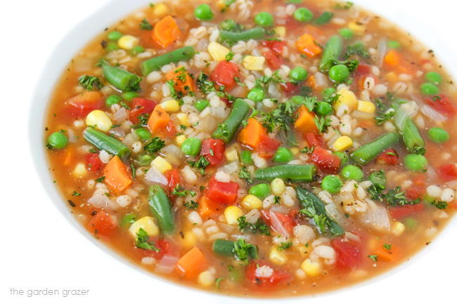 Bowl of soup garnished with fresh parsley