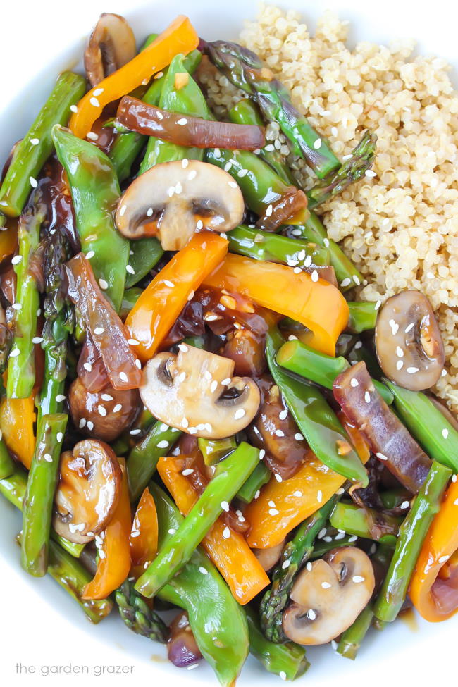 Stir-fried vegetables in a bowl with sesame seeds