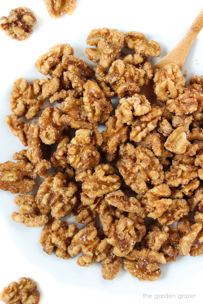 Healthy candied nuts with maple syrup on a white plate