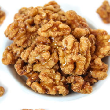 Bowl of maple candied walnuts with vanilla