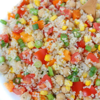 Bowl of quinoa vegetable salad with lemon basil dressing