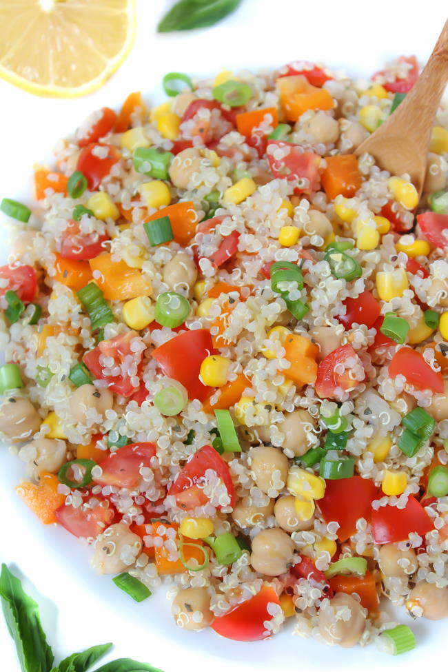 Bowl of quinoa vegetable salad with lemon basil dressing