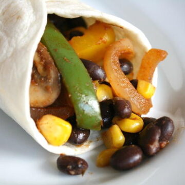 Black bean fajitas in a tortilla on a plate