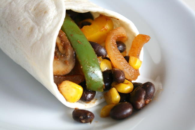 Black bean fajitas in a tortilla on a plate