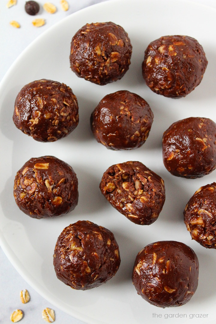 Rolled chocolate oat balls arranged on a white serving plate