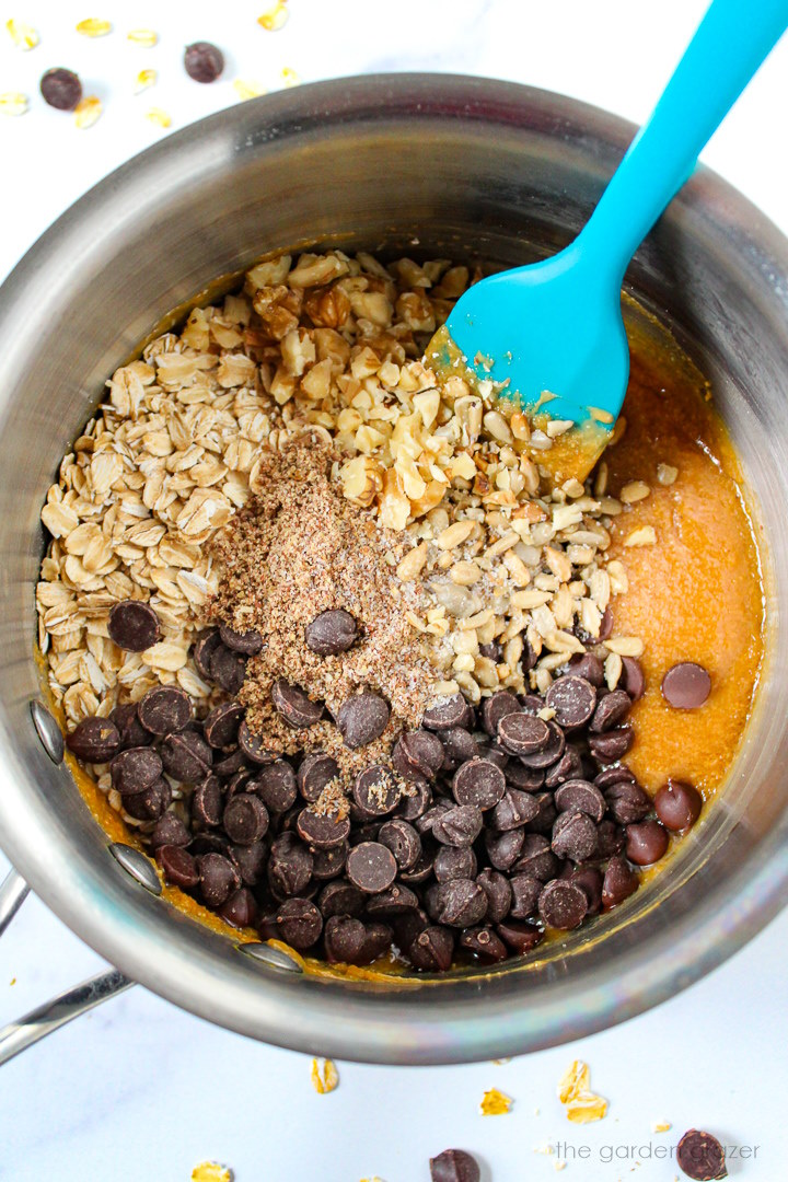 Overhead view of preparing ingredients in a small pot before heating and mixing together