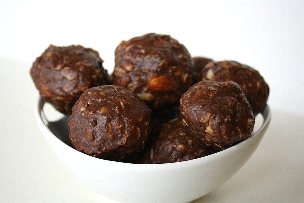 Vegan chocolate peanut butter oat balls in a small bowl