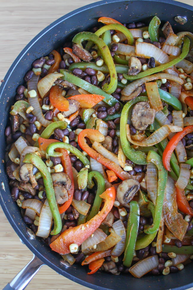 Corn and black bean fajitas in a skillet