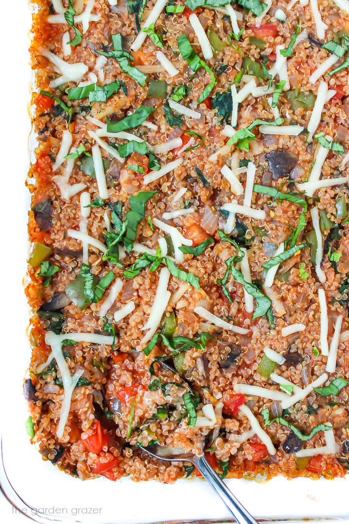 Overhead view of vegan pizza quinoa casserole in a large glass baking dish
