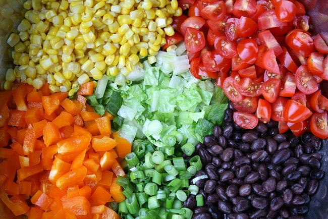 Ingredients in a bowl for southwestern chopped salad