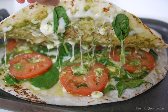 Inside of the pesto quesadilla as it's heating on a pan