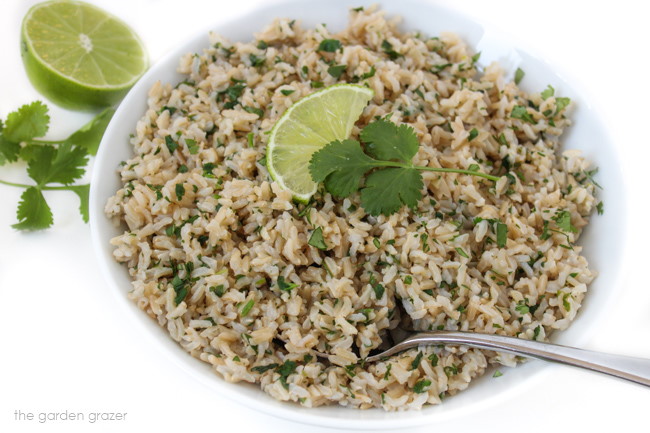 White bowl with rice and a serving spoon