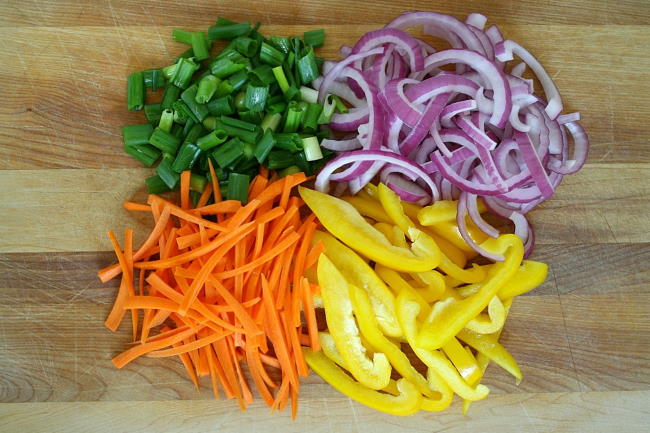 Fresh cut vegetable ingredients on a cutting board