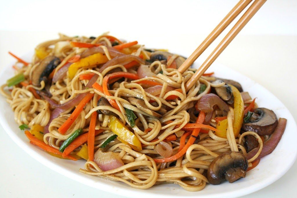 Vegetable Lo Mein on a plate with chopsticks