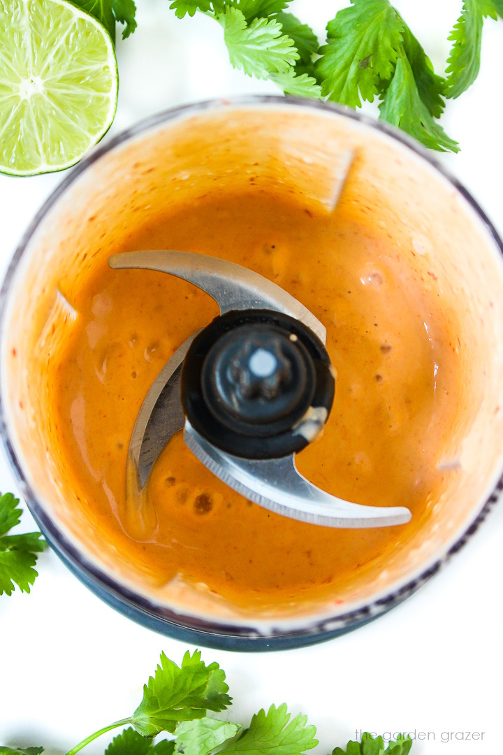 Overhead view of creamy yogurt chipotle sauce blended in a small food processor