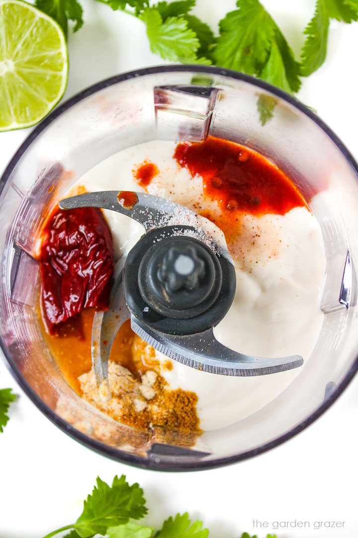 Preparing ingredients in a small food processor before blending together