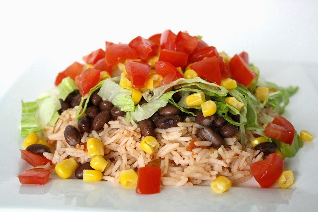 Preparing the rice with beans and vegetables