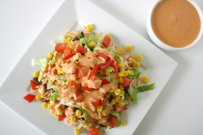 Vegan black bean and rice burrito bowl with chipotle sauce