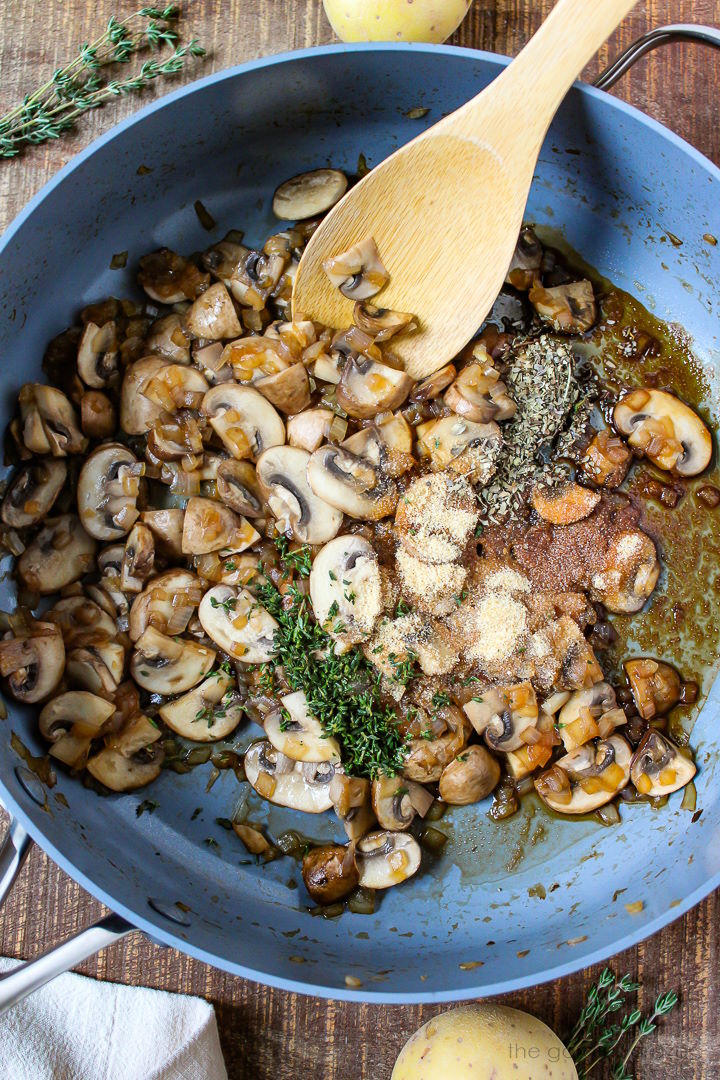 Overhead view of preparing gravy ingredients in a large skillet before mixing together