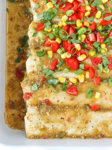 White bean zucchini enchiladas in a white pan