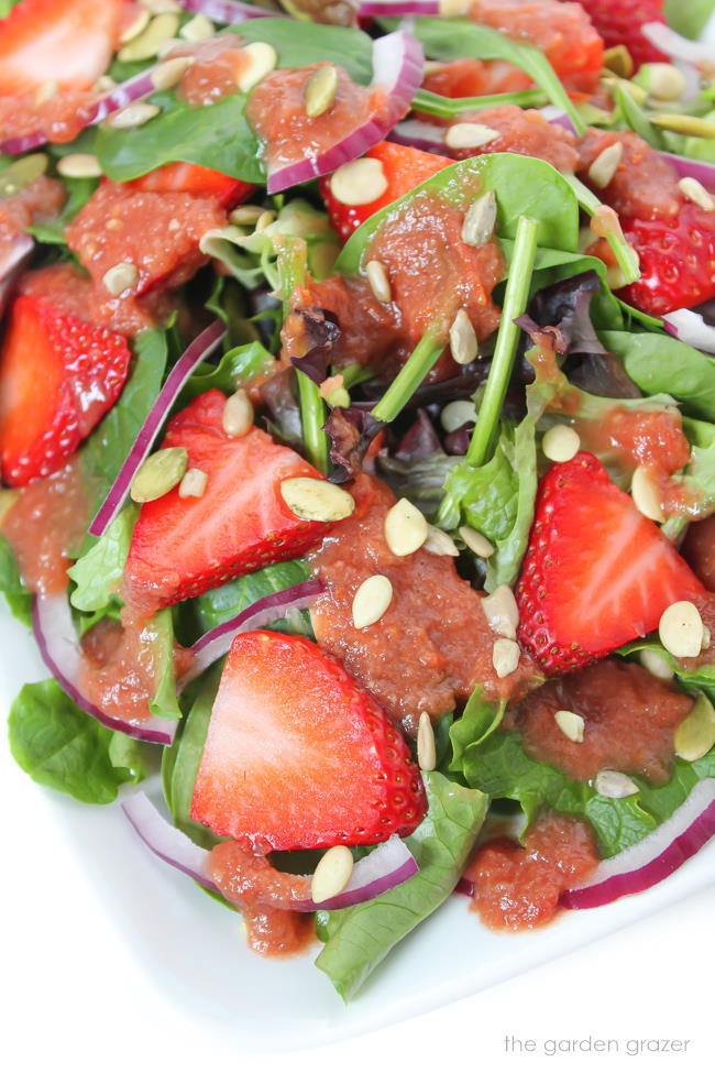 Strawberry Spinach Salad on a plate with balsamic dressing