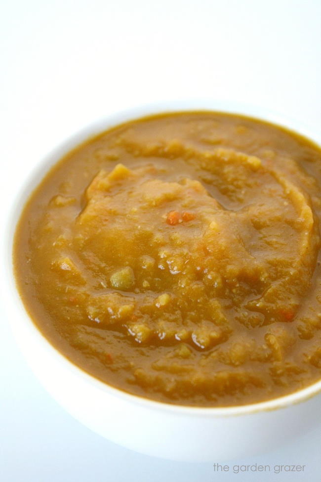 Blended pea soup in a white bowl
