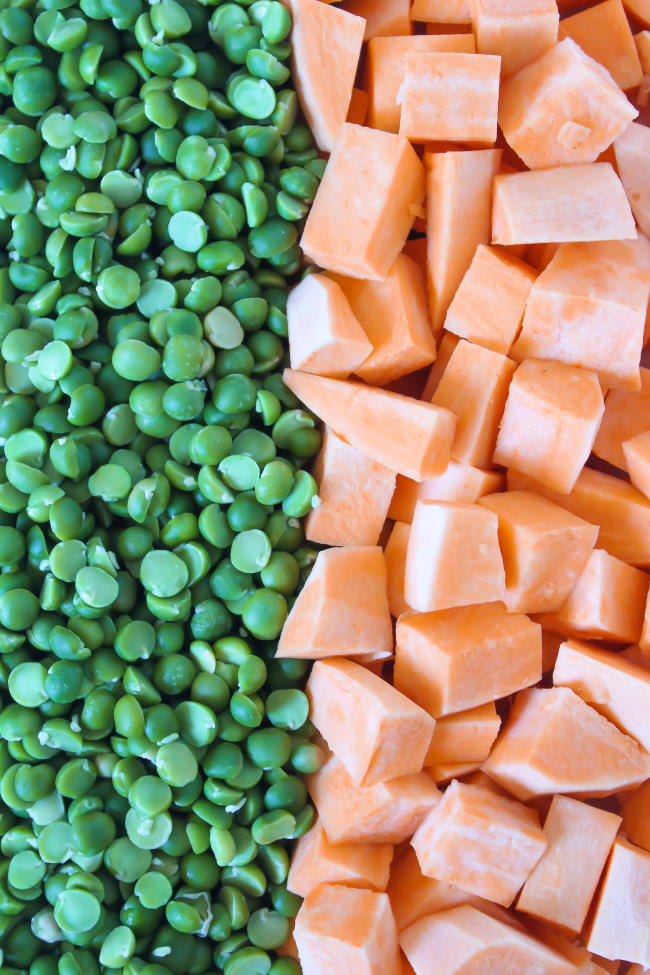 Green split peas arranged next to cubed raw sweet potatoes