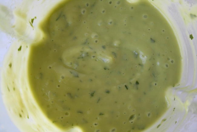 Preparing creamy avocado dressing in a blender