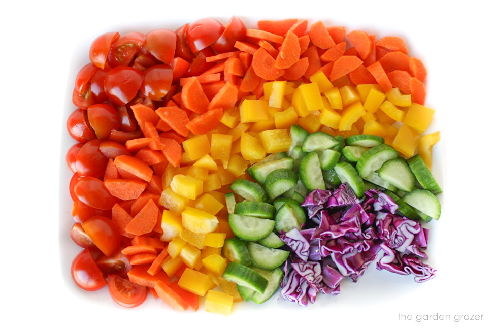 Fresh vegetables diced on a white plate