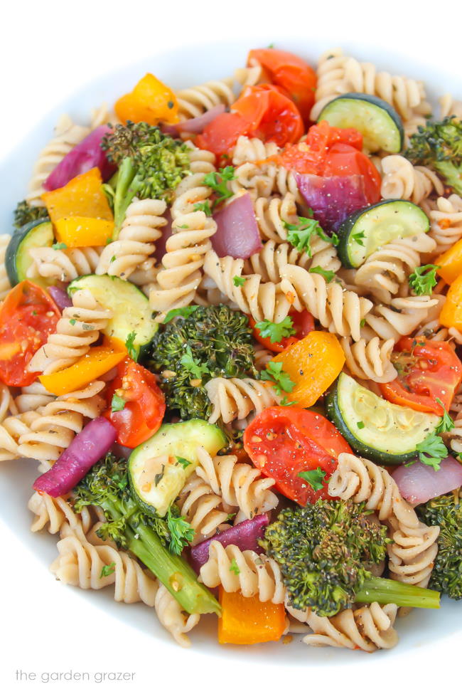 Vegan roasted vegetable pasta with balsamic in a white bowl