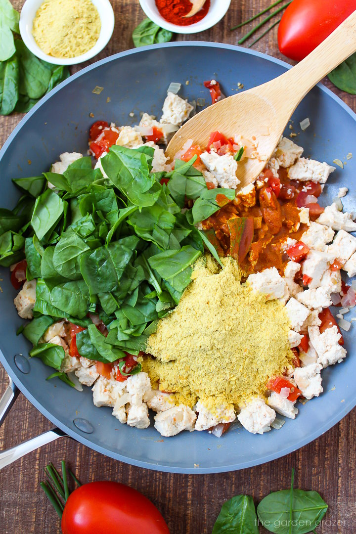Preparing scramble ingredients in a skillet before mixing together