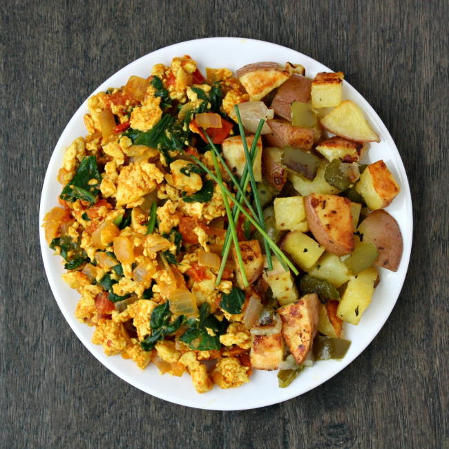 Plate of tofu scramble with roasted breakfast potatoes