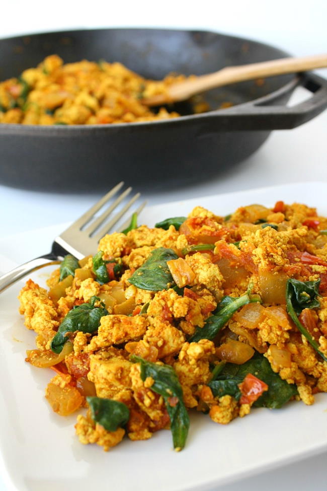 Plate of vegan breakfast scramble with a skillet in background