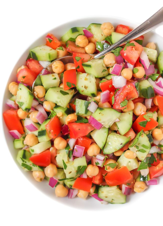 Greek Chopped Salad in a bowl with spoon