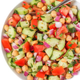 Greek Chopped Salad in a bowl with spoon