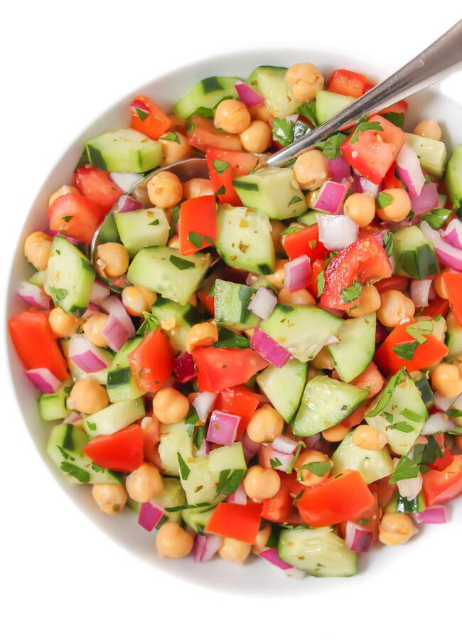 Greek Chopped Salad in a bowl with spoon
